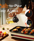 Game Changing Glass Olive Oil Sprayer For Cooking, 16 Oz Dual Pump Dispenser Bottle in use over grill.