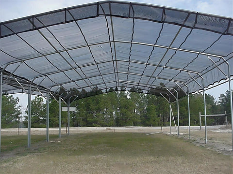 Large outdoor structure using 40 Percent Shade Cloth For Plants 10x50ft Sun Shade Fabric With Clips Black Durable HDPE Mesh over a metal frame.