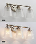 Above view of Three Light Bathroom Vanity Light Fixtures Over Mirror in Brushed Nickel Finish with Crystal Glass Shades, on and off.