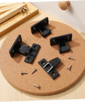 10 Pack Concealed Push On Corner Connectors For Wooden Furniture And Cabinets Quick Snap Install Right Angle Joint Brackets With Screws, black plastic connectors with screws on cork surface.