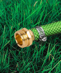 Premium One Half Inch Aluminum Hose Repair Connector Kit With Stainless Steel Clamp installed on green garden hose