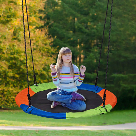 Child sitting on 40 Inch Kids Saucer Tree Swing Set With 600D Heavy Duty Oxford Fabric Platform Seat, Steel Frame And Carabiner Support
