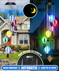Solar Wind Chimes Outdoor Decor With Hot Air Balloon Lights Waterproof Garden Patio Lighting Lit At Night Perfect Gift For Mothers Day Mom Grandma Birthday; multicolor chimes in day and night view against a house backdrop