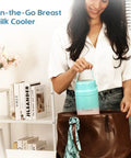 Woman placing 22oz Portable Breast Milk Cooler Bottle with Two BPA-Free Bottles into a stylish brown bag.
