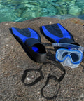 Diving gear on rock including blue flippers, mask, and Heavy Duty Scuba Tank Band And Retainer Strap With Portable Handle