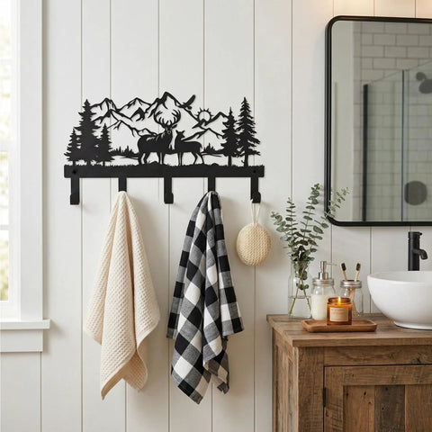 Deer Mountain Metal Key Holder Wall Mount For Rustic Cabin Decor installed on white wall with towels hanging