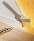 Cable Hider For Walls 315 Inch Long Cord Covers being painted to match wall color with paintbrush, part of Easy Mount Cable Raceway Kit
