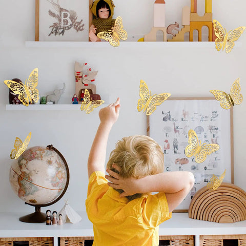 Child in room with Gold Butterflies Wall Decor Kit With 72 Removable Wall Stickers In 3 Styles And 3 Sizes For Party Birthday Wedding Cake Decor And Room Makeover Easy To Apply Kid Approved on wall
