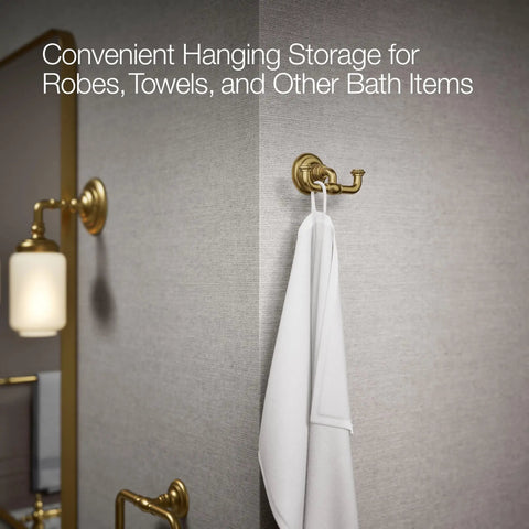 Artifacts Double Robe Hook In Vibrant Brushed Moderne Brass For Bathroom Storage shown with white towel in modern bathroom.