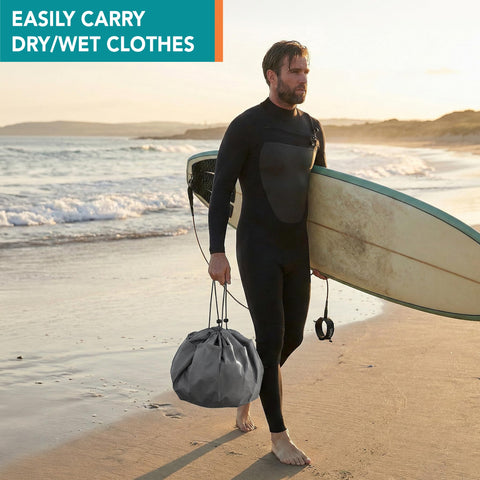 Surfer on beach holding surfboard and Wetsuit Changing Mat And Dry Bag For Surfing And Kayaking All In One 30 Inch Leakproof Gear Mat
