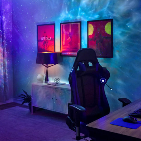 Sky Lite Evolve LED Galaxy Cloud Projector With Wi Fi Ambient Night Light Remote Control Black Finish For Cozy Movie Nights Sleep Aid And Chill Home Vibes illuminating a gaming room.