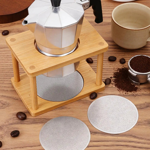 Hella Smooth Reusable Stainless Steel Coffee Filter Fine Mesh Compatible With AeroPress And Ultra Fine Brewers 51Mm displayed with coffee maker and mugs.