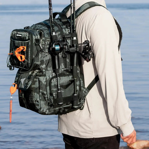 Person wearing a 50L Fishing Tackle Backpack with Removable Bait Binder and Four Tackle Boxes Two Rod Holders Interchangeable Storage System