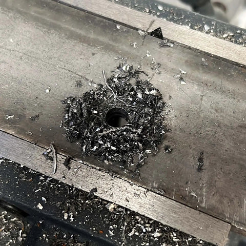 Beefy Five Percent Cobalt Drill Bit Set 1/16 To 1/4 Inch, metal drilled hole with shavings, M35 High Speed Steel Twist Bits in use