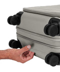 Softside Bigger Carry On Luggage 23 Inch Expandable With Spinner Wheels Built Tough Nylon TSA Accepted Color Matching Padlock Airline Approved For Most Major Airlines Cloud Gray, showing close-up of expansion and wheels