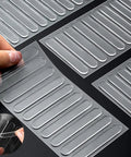 Clear Stick-On Cabinet Door Bumpers Pack Of 40 for Quiet Closings and Wall Protection shown with hand peeling sheet