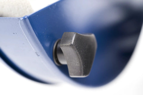 Close-up of safety eye shield adjuster on slow speed 8 inch bench grinder with one half HP motor 1750 RPM.