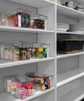 Hella Organized Plastic Storage Bins With Lids storing snacks and supplies, clear bins 11 x 7.5 x 6 inches, neatly arranged on shelves.