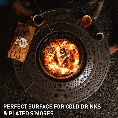 Top view of 42 Inch Fire Pit Surround Tabletop Shield For Wood Burning Pits with s'mores placed nearby, steel frame.