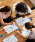 Students using Dry Erase XY Axis Graph Lap Boards 9 By 12 Inches For Student And Classroom Use Double Sided Whiteboards at a desk