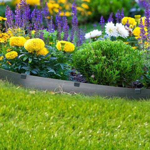 Garden with flowers secured by terrace boards using 40 Pack Landscape Anchoring Stakes 10 Inch Garden Stakes For Terrace Boards Weed Fabric And Inflatable Decor Fixing Heavy Duty ABS Outdoor Stakes Built To Last For Quick Setup And Strong Stability In Any Yard.
