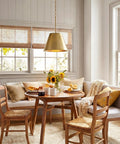 12 Inch Modern Gold Pendant Light With Tapered Metal Shade hanging over kitchen dining area with warm brass finish