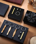 Front view of XunYee 12-piece woodturning keychain kit: four wooden-handled keyring tools, brass rod and fittings in gift box.
