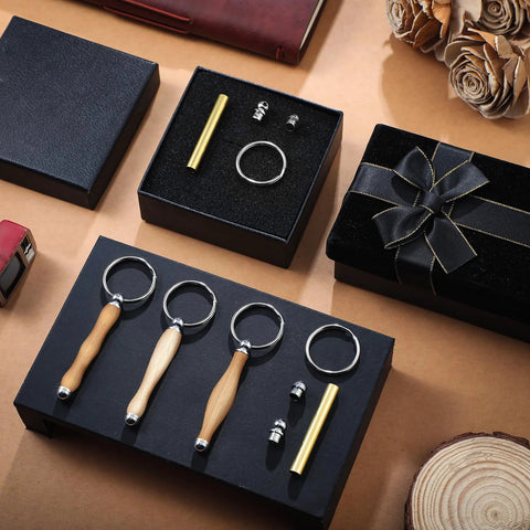 Front view of XunYee 12-piece woodturning keychain kit: four wooden-handled keyring tools, brass rod and fittings in gift box.