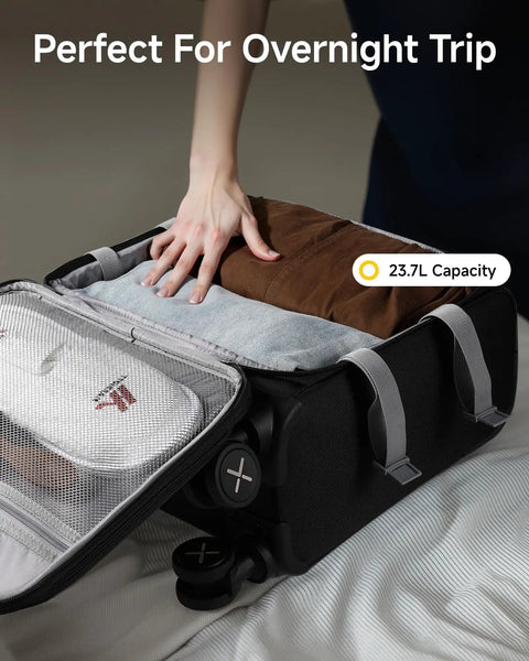 Person packing clothes in Underseat Carry-On Luggage With Spinner Wheels, Soft Sided 15 Inch Travel Case For Air Travel And Business, Black