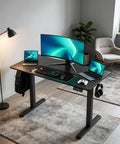 WankaMom Electric Standing Desk With Smooth Silent Lift And 154 Lbs Load Capacity, Premium Carbon Steel Frame height adjustable with gaming setup.