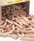 Box spilling out five sixteenths inch wood dowel pins set with 225 pieces kiln dried hardwood fluted beveled for woodworking.