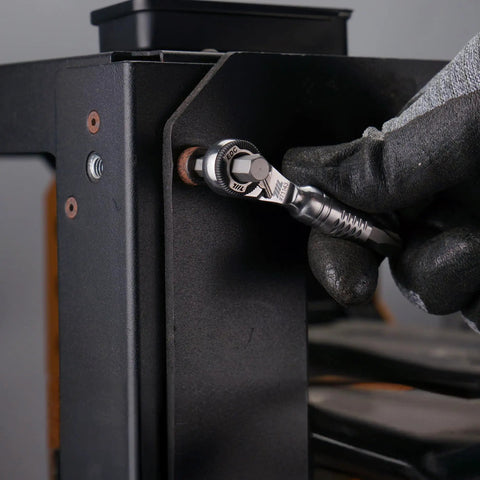 Using Ultra Compact One Quarter Inch Ratchet Wrench For Tight Spaces Stainless Steel EDC Tool on metal frame
