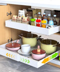 Two Pack Expandable Pull Out Cabinet Organizers 21 Inch Deep Skip The Drilling With Stick Tight Nano Tape Slide Out Drawer Shelves Adjustable Width Fits Framed Cabinets Kitchen Pantry with pots and pantry items.