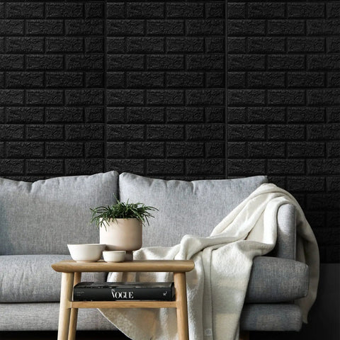 Living room with Black Faux Brick Peel And Stick Wall Panels, sofa, and decor, showcasing durable acoustic wall covering.