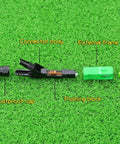 Side view of FTTH SC APC optical fiber quick connector set with dustproof cap and green external frame.