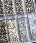 Assorted micro screws, nuts, and washers in a plastic tub for electronics repair. Badass Slick Stainless Steel Micro Screws And Nuts Kit For Eyeglasses Smartwatches Phones Tablets Laptop Repair Assorted Tiny Fasteners Heavy Duty Toolbox Must Have Accessory.