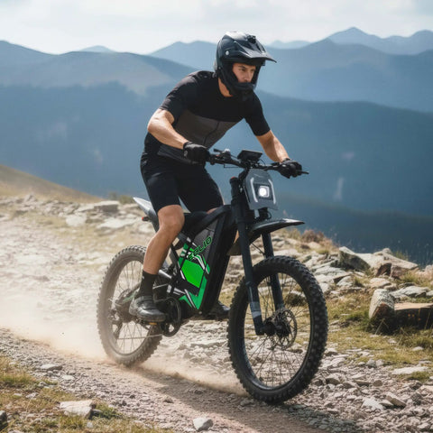 Adult riding Heavy Duty Adult Electric Dirt Bike With Full Suspension Fat Tires And Hydraulic Brakes on rocky trail.