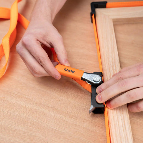 Using Heavy-Duty Adjustable Band Clamp For Woodworking And Framing, 15-Foot Strap, Self-Locking Ratcheting Handle on frame