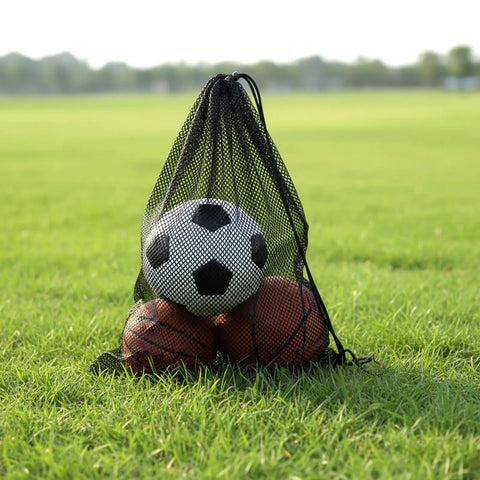 Two Pack Oversized Mesh Swim Bags With Drawstring Net For Snorkel Gear 19 By 27 Inches holding soccer and basketballs on grass