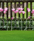 White Garden Fence Border 18 Inch High 50 Feet Long Foldable Metal Wire Panel Fencing For Yard Flower Bed Patio Edging Outdoor Landscape Decor Rustproof And Easy To Install No Tools Required installed in front of pink flowers