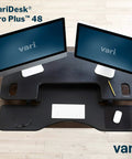 Dual Monitor Sit Stand Desk Riser 48 Inch Wide Desk Converter With 11 Height Settings Fully Assembled Spring Loaded Lift Lower Keyboard Deck Black Finish For Home Office And Workspaces shown with dual monitors and keyboard