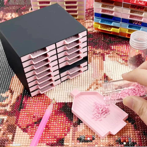 All-In-One 16-Drawer Diamond Art Tray Organizer Rack For Diamond Painting Supplies, Diamond Drill Storage Box, DIY Art Tools And Accessories, Solid Black Organizer For Color Sorting, Beads, And Craft Tools, shown with pink trays and beads.