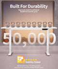 Sleek BIZUM Electric Standing Desk 60 x 24 Inch White with kettlebells demonstrating durability and stability tested for 50,000 cycles.