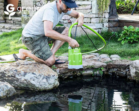 Green Expert 1/4HP submersible sump pump with 25-foot power cord used beside a pond