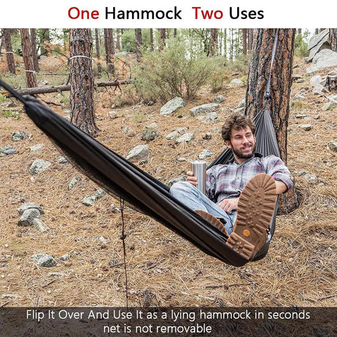 Person relaxing in Double Tree Hammock With Built In Net For Camping And Travel, set up in forest with practical strap system.