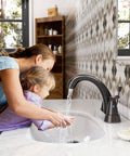Oil Rubbed Bronze 4 Inch Centerset Bathroom Faucet With Two Handles And Lift Rod Drain Assembly in use at vanity sink