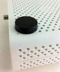 Sorbothane Heavy Duty Vibration Isolation Circular Disc Pad 0.25 Inch Thick on perforated white surface