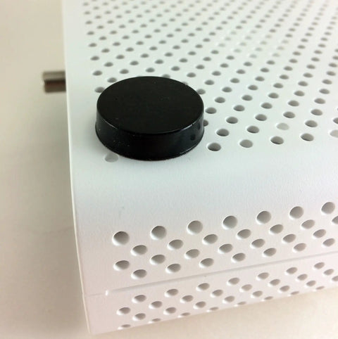 Sorbothane Heavy Duty Vibration Isolation Circular Disc Pad 0.25 Inch Thick on perforated white surface