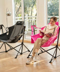 Woman seated on pink Padded Oversized Hammock Camping Chair With Multi Storage Pockets, Portable Foldable Rocking Swing Chair indoors