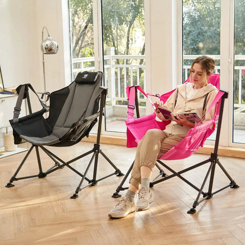 Woman seated on pink Padded Oversized Hammock Camping Chair With Multi Storage Pockets, Portable Foldable Rocking Swing Chair indoors